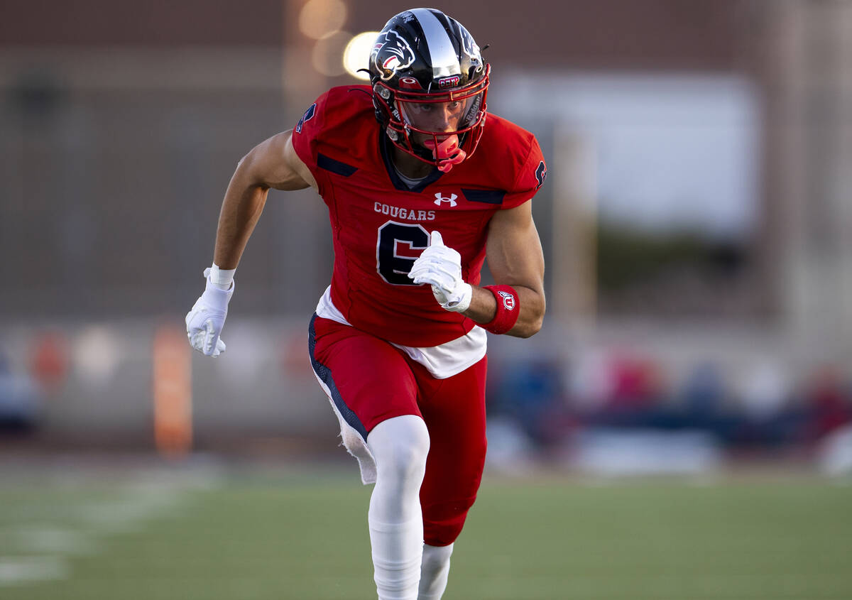 Coronado senior JJ Buchanan (6) runs down the field during the high school football game agains ...