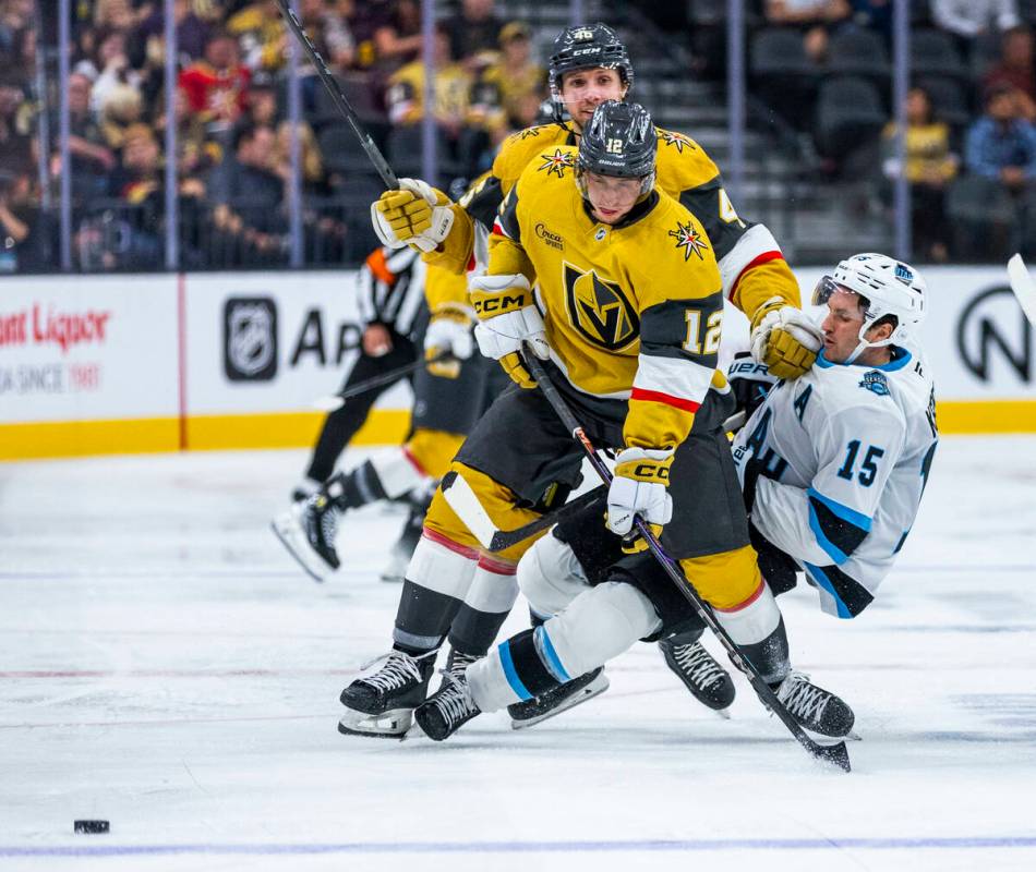 Golden Knights center Jakub Brabenec (12) chases the puck as Utah Hockey Club forward Alex Kerf ...