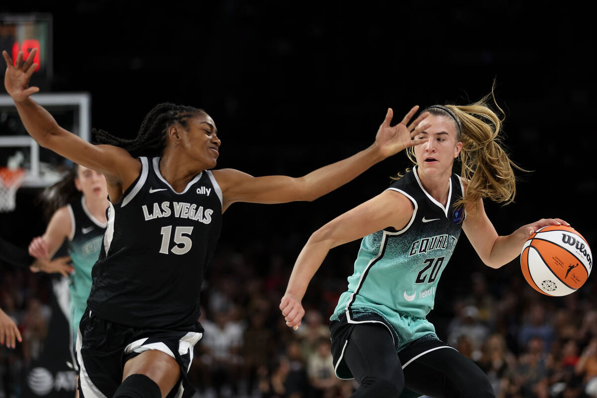 Las Vegas Aces guard Tiffany Hayes (15) defends while New York Liberty guard Sabrina Ionescu (2 ...