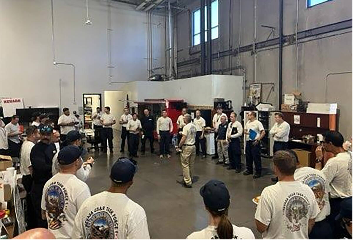 About 45 members of Nevada Task Force-1 are briefed about their mission on Friday, Sept. 27, 20 ...