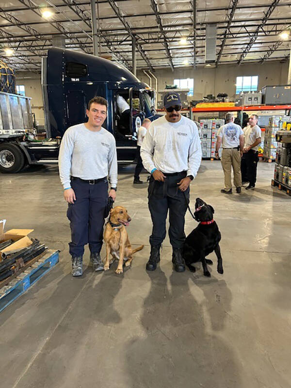 Two of the K-9s and their handlers that are on their way Friday, Sept. 27, 2024, to the Atlanta ...