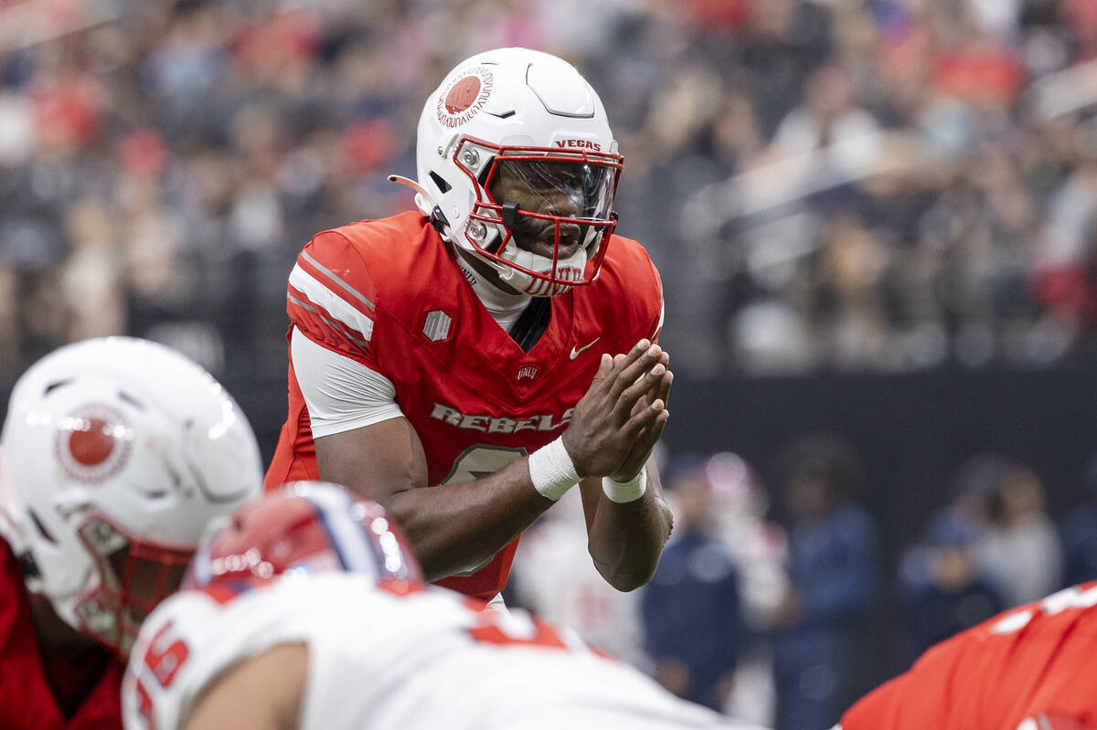 UNLV quarterback Hajj-Malik Williams (6) prepares to snap the ball during the college football ...