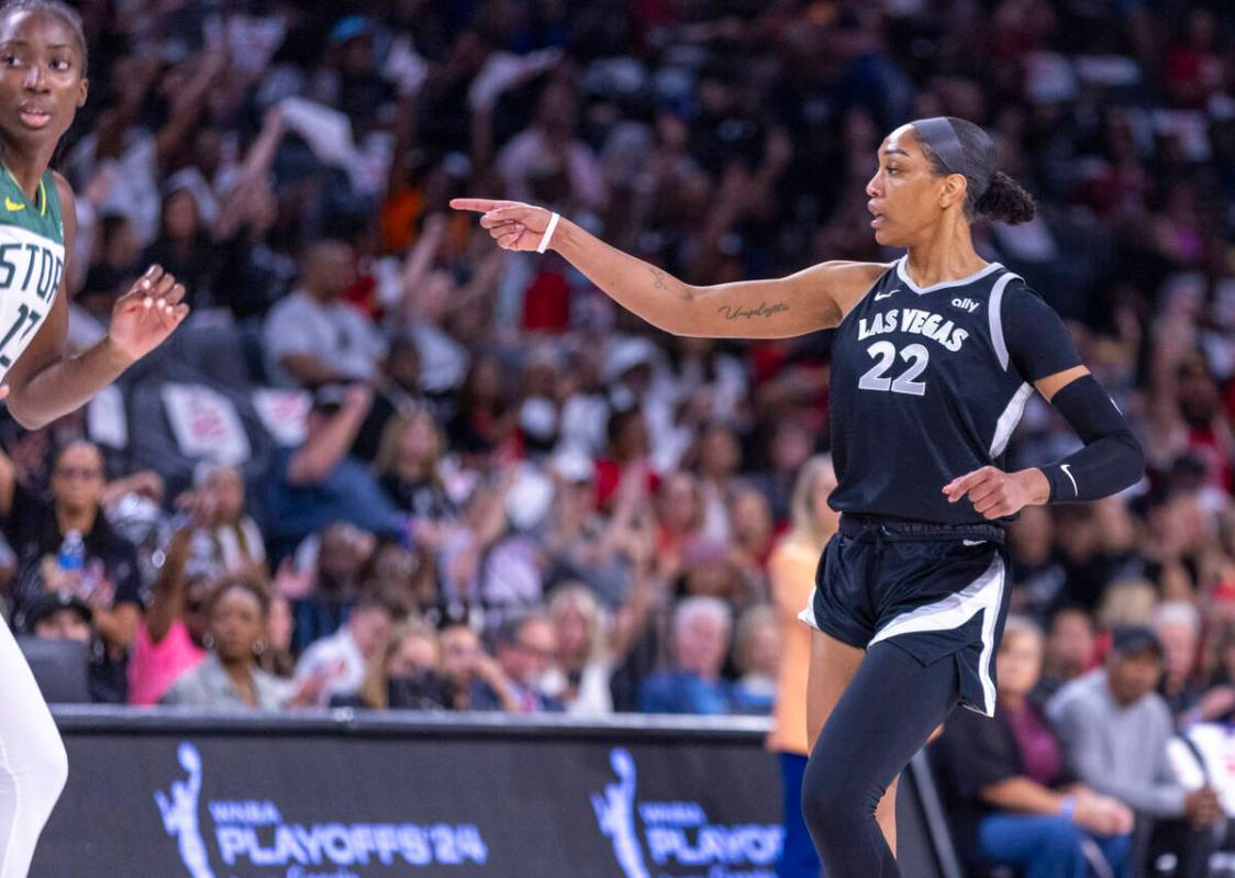 Aces center A'ja Wilson (22) signals her teammate during the first half of their WNBA playoffs ...