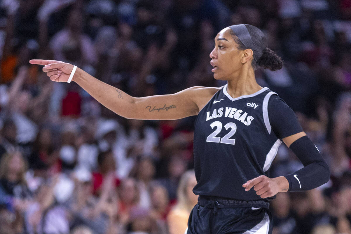 Aces center A'ja Wilson (22) signals her teammate during the first half of their WNBA playoffs ...