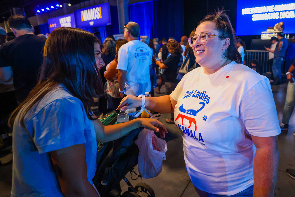 Kat Rodgers, right, sports a “cat women for Kamala” shirt during a campaign event ...