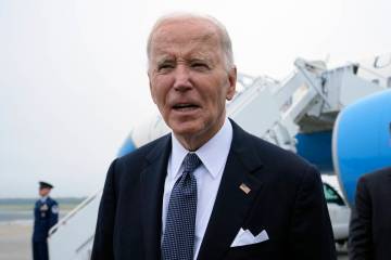 President Joe Biden speaks the the media after stepping off Air Force One at Dover Air Force Ba ...