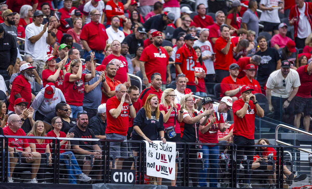 UNLV fans show their dislike for Sluka with a sign as the team dominates over Fresno State Bull ...