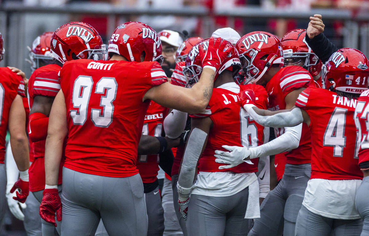 UNLV defensive back Jeremiah Vessel (6) is congratulated for a late interception over the Fresn ...