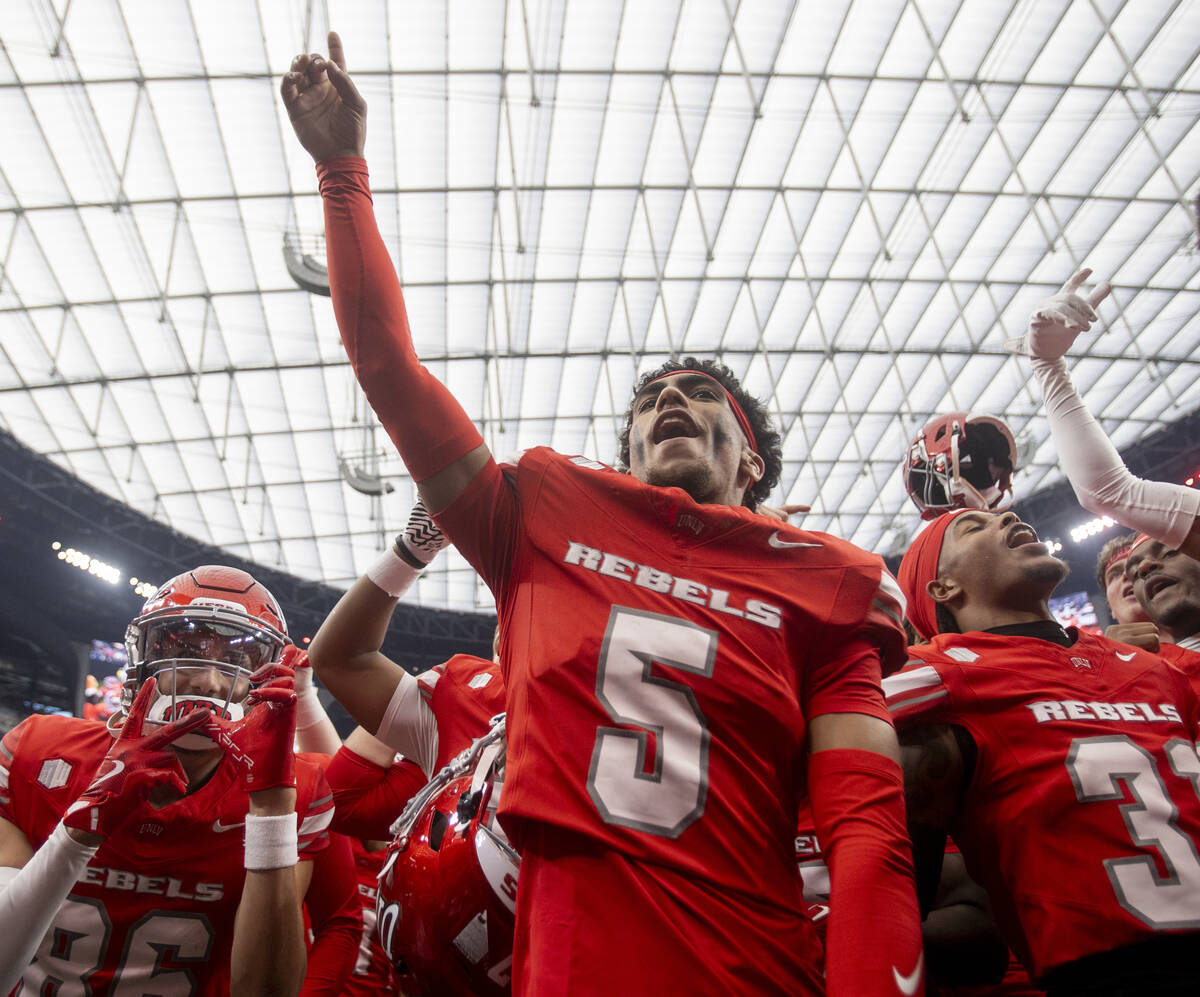 UNLV defensive back Cameron Oliver (5) dances with his teammates after defeating Fresno State 5 ...