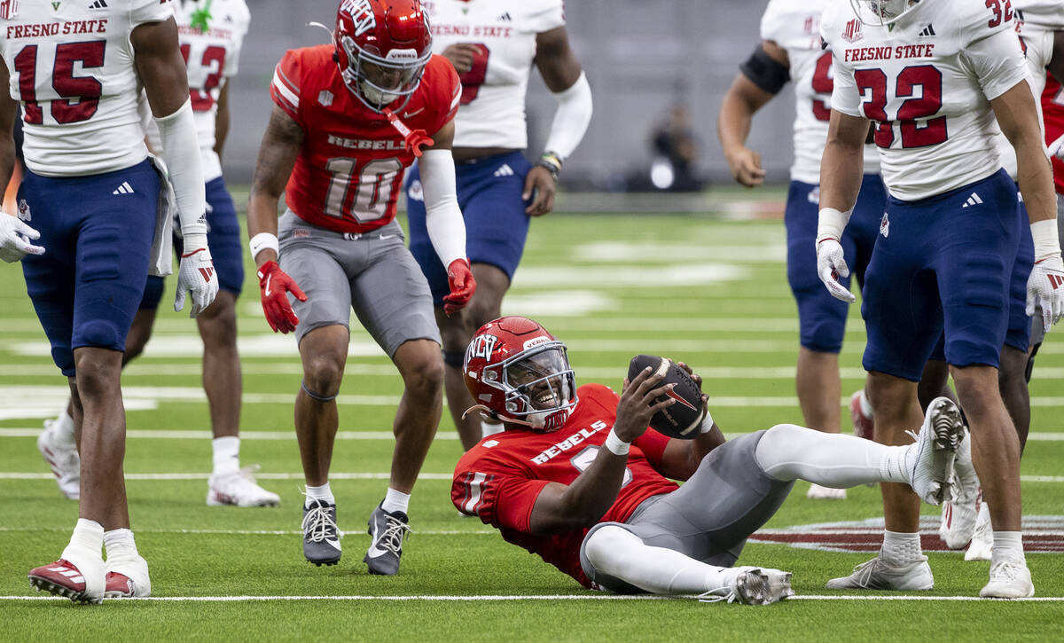 UNLV quarterback Hajj-Malik Williams (6) smiles after making a first down during the college fo ...