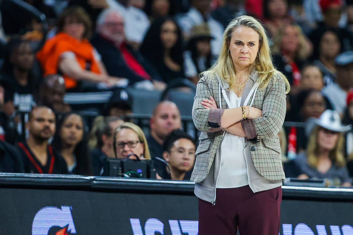 Aces head coach Becky Hammon watches from the sidelines during game one of a WNBA playoff game ...