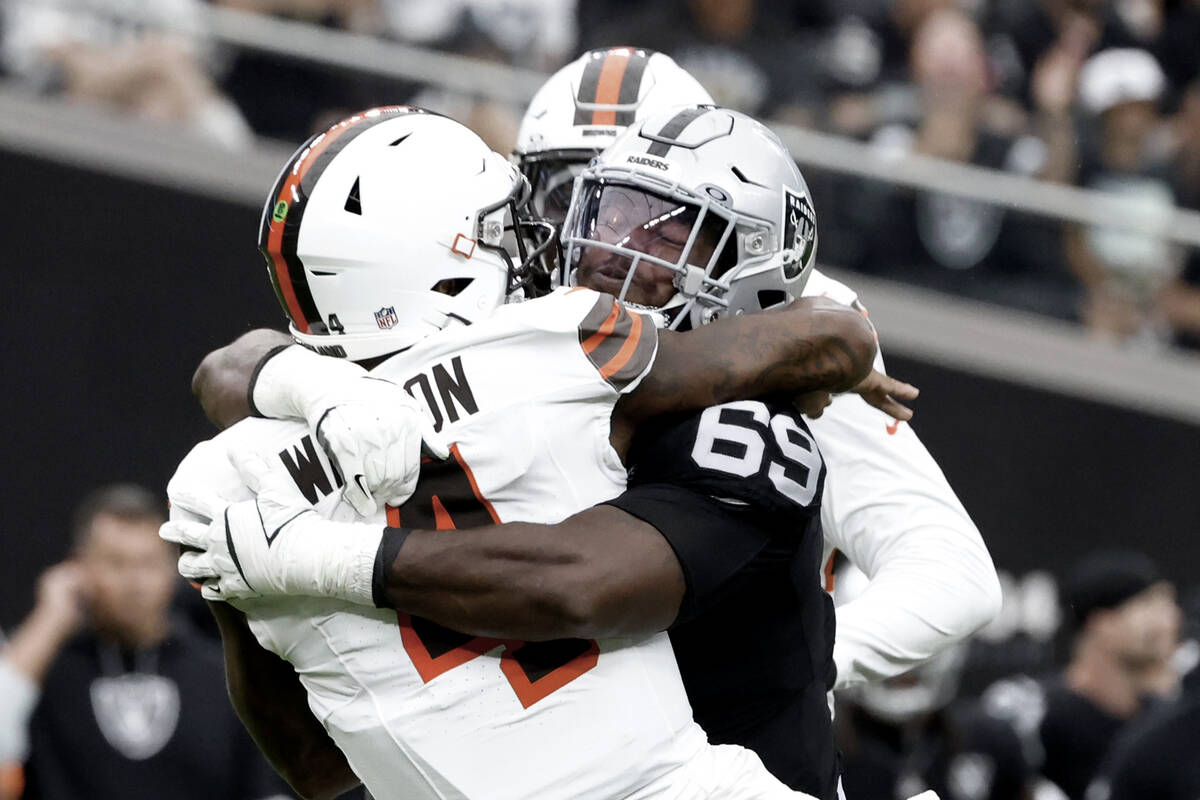 Raiders defensive tackle Adam Butler (69) sacks Cleveland Browns quarterback Deshaun Watson (4) ...