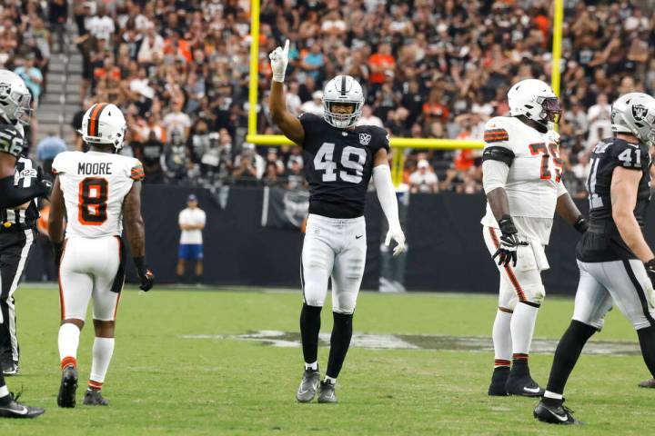 Raiders defensive end Charles Snowden (49) reacts after sacking Cleveland Browns quarterback De ...