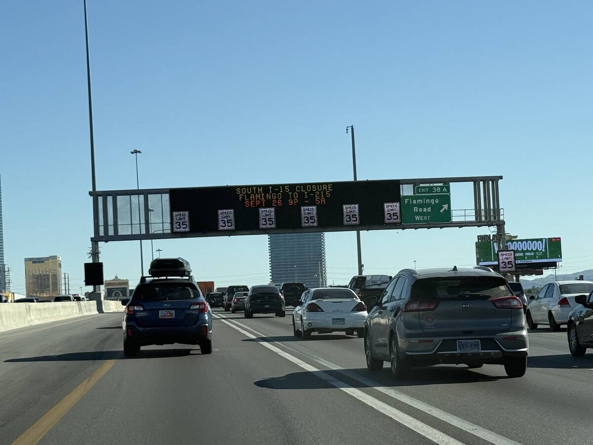 Motorists travel near one of the many active traffic management signs that help traffic move sm ...