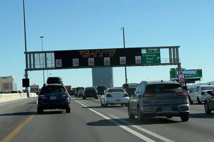 Motorists travel near one of the many active traffic management signs that help traffic move sm ...