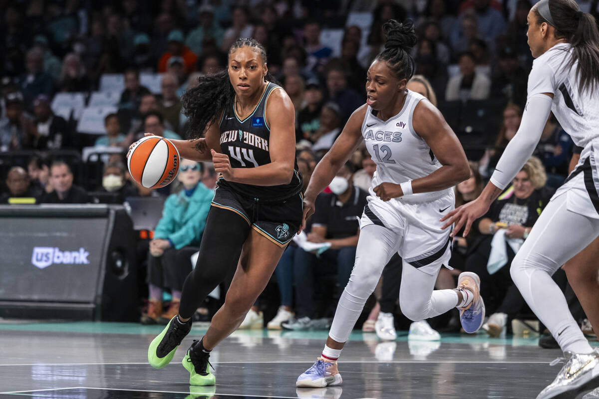 New York Liberty forward Betnijah Laney-Hamilton (44) is defended by Las Vegas Aces guard Chels ...