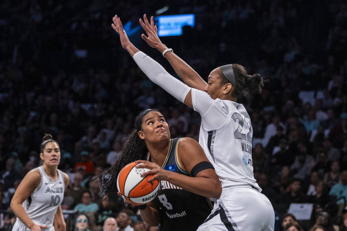 New York Liberty forward Nyara Sabally (8) is defended by Las Vegas Aces center A'ja Wilson (22 ...