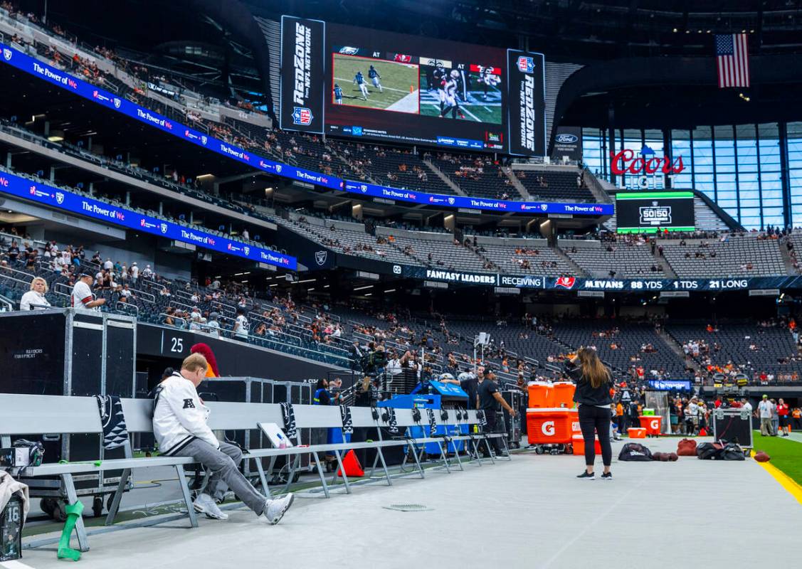 Raiders owner Mark Davis watches the Aces game from the bench during the warm ups of their NFL ...