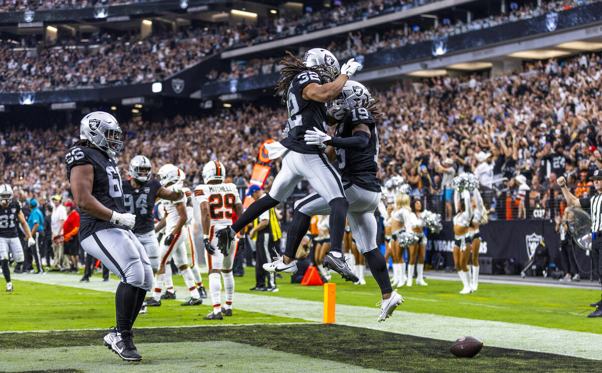 Raiders wide receiver DJ Turner (19) celebrates a score with Raiders wide receiver Tyreik McAll ...