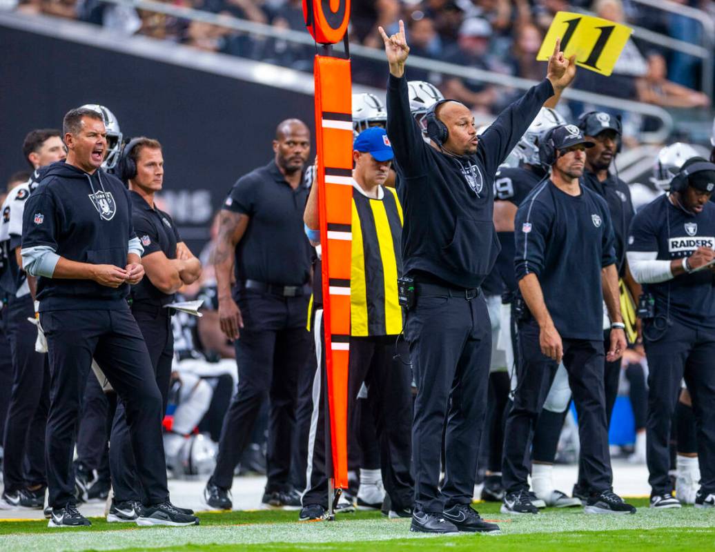 Raiders Head Coach Antonio Pierce signals players on the field against the Cleveland Browns dur ...