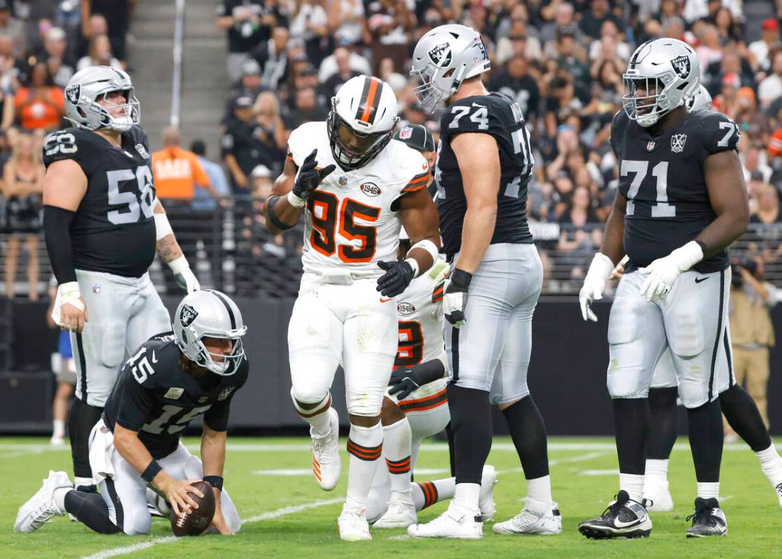 Raiders defensive end Charles Snowden (49) reacts after sacking the Cleveland Browns quarterbac ...