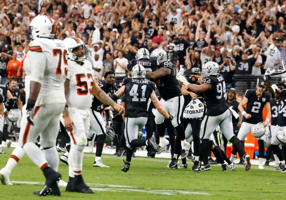 Raiders players celebrate after defeating the Cleveland Browns 20-16 during an NFL game at Alle ...