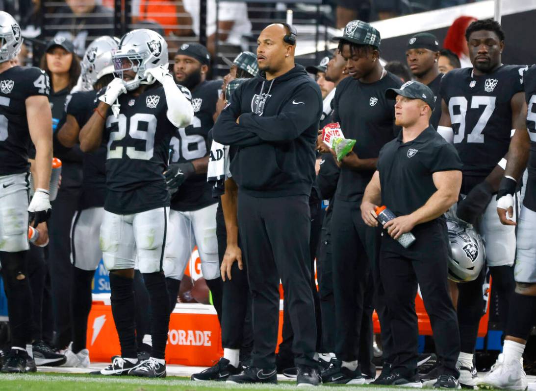 Raiders head coach Antonio Pierce watches the game from the sidelines during the second half of ...