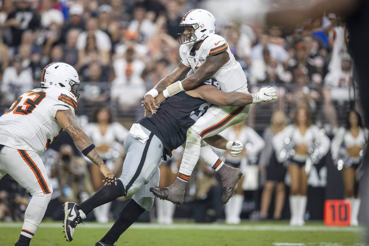 Raiders defensive tackle Christian Wilkins (94) hits Cleveland Browns quarterback Deshaun Watso ...