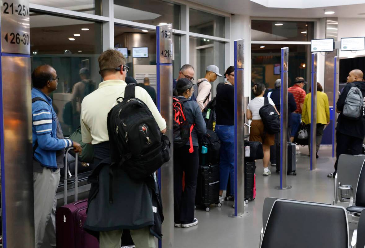 Passengers line up based on boarding group numbers to board a Southwest Airlines flight at Oakl ...