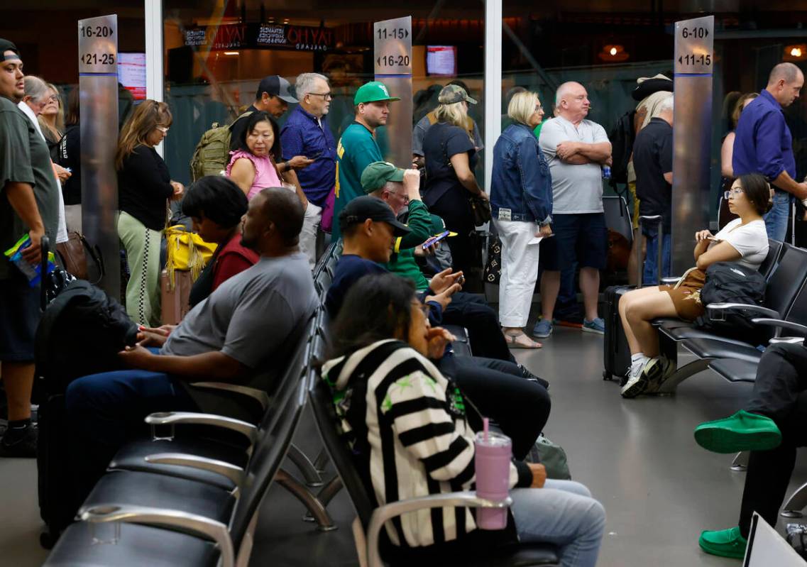 Passengers line up based on boarding group numbers to board a Southwest Airlines flight at Oakl ...