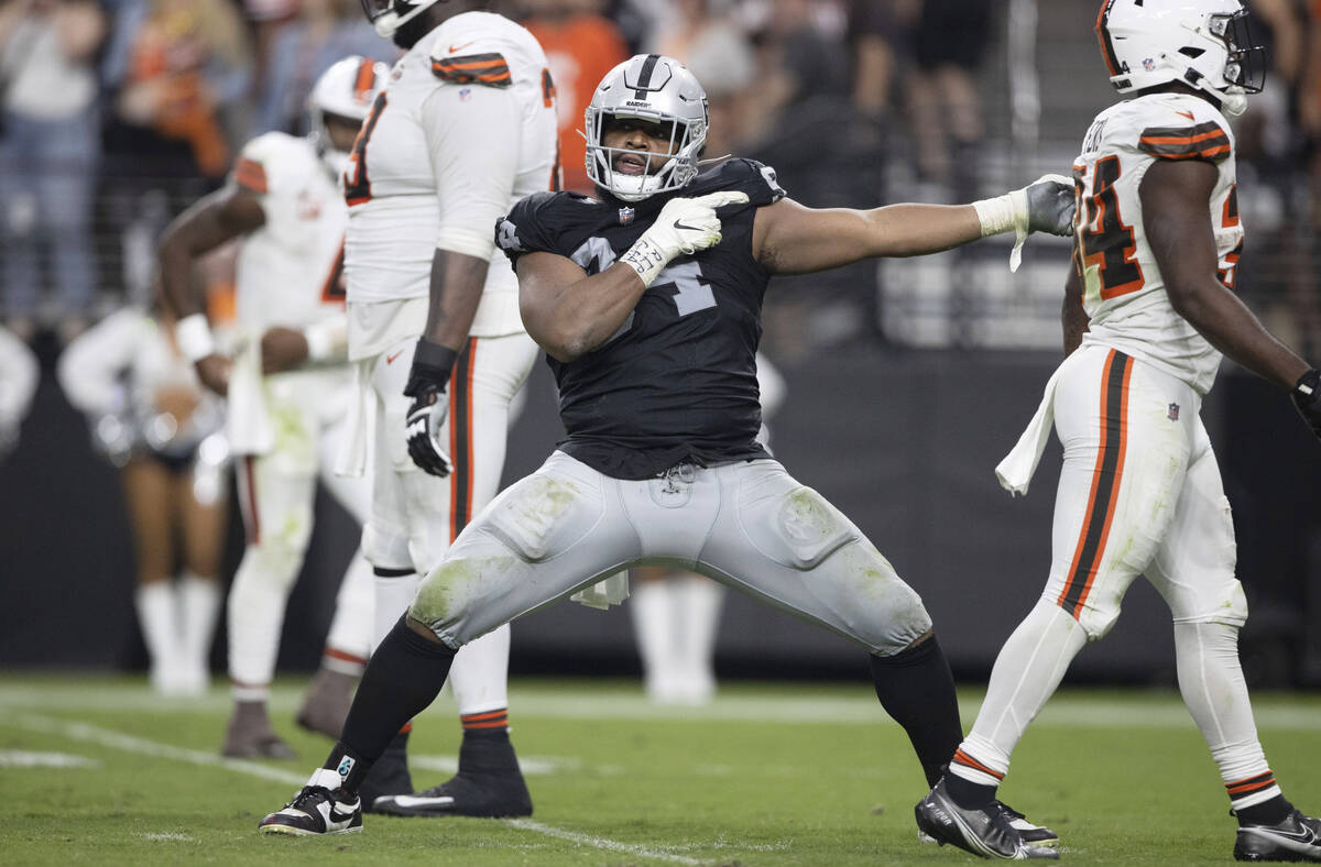 Raiders defensive tackle Christian Wilkins (94) signals for the Raiders to get the football aft ...