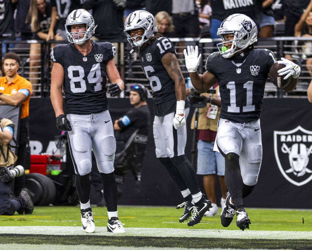 Raiders wide receiver Tre Tucker (11) celebrates a score over Cleveland Browns safety Ronnie Hi ...