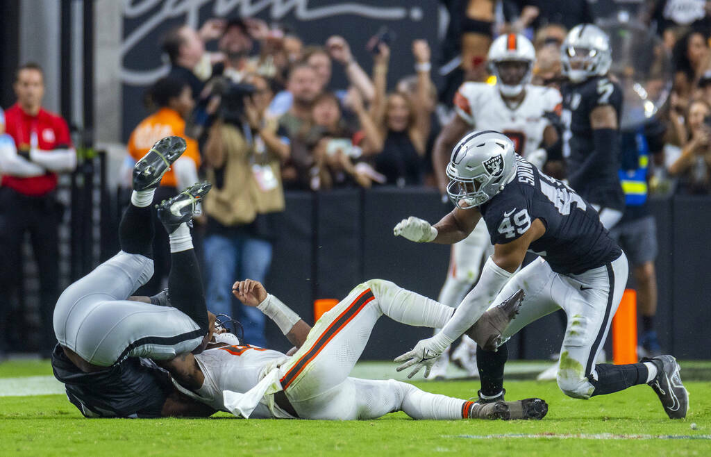 Cleveland Browns quarterback Deshaun Watson (4) is sacked late by Raiders defensive end Charles ...