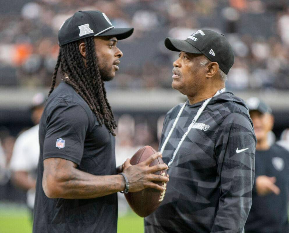 Raiders wide receiver Davante Adams, left, with former Raiders defensive back George Atkinson b ...