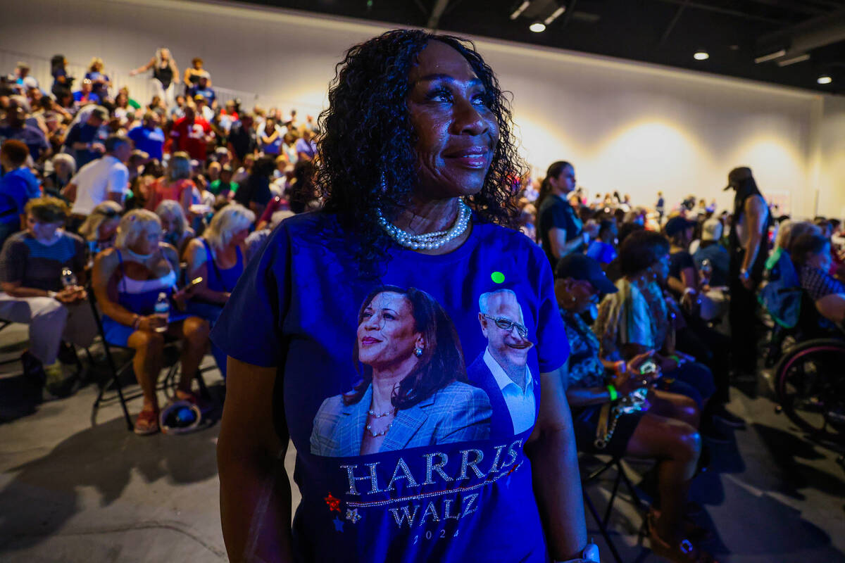 Angel Perry shows off a homemade bejeweled shirt during a campaign event for Democratic preside ...