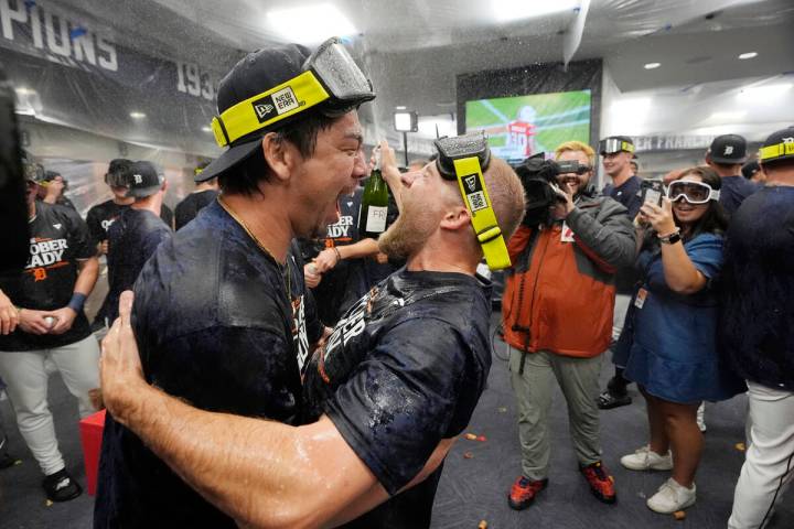 Detroit Tigers pitchers Kenta Maeda, left, and Will Vest celebrate their AL wild card berth aft ...