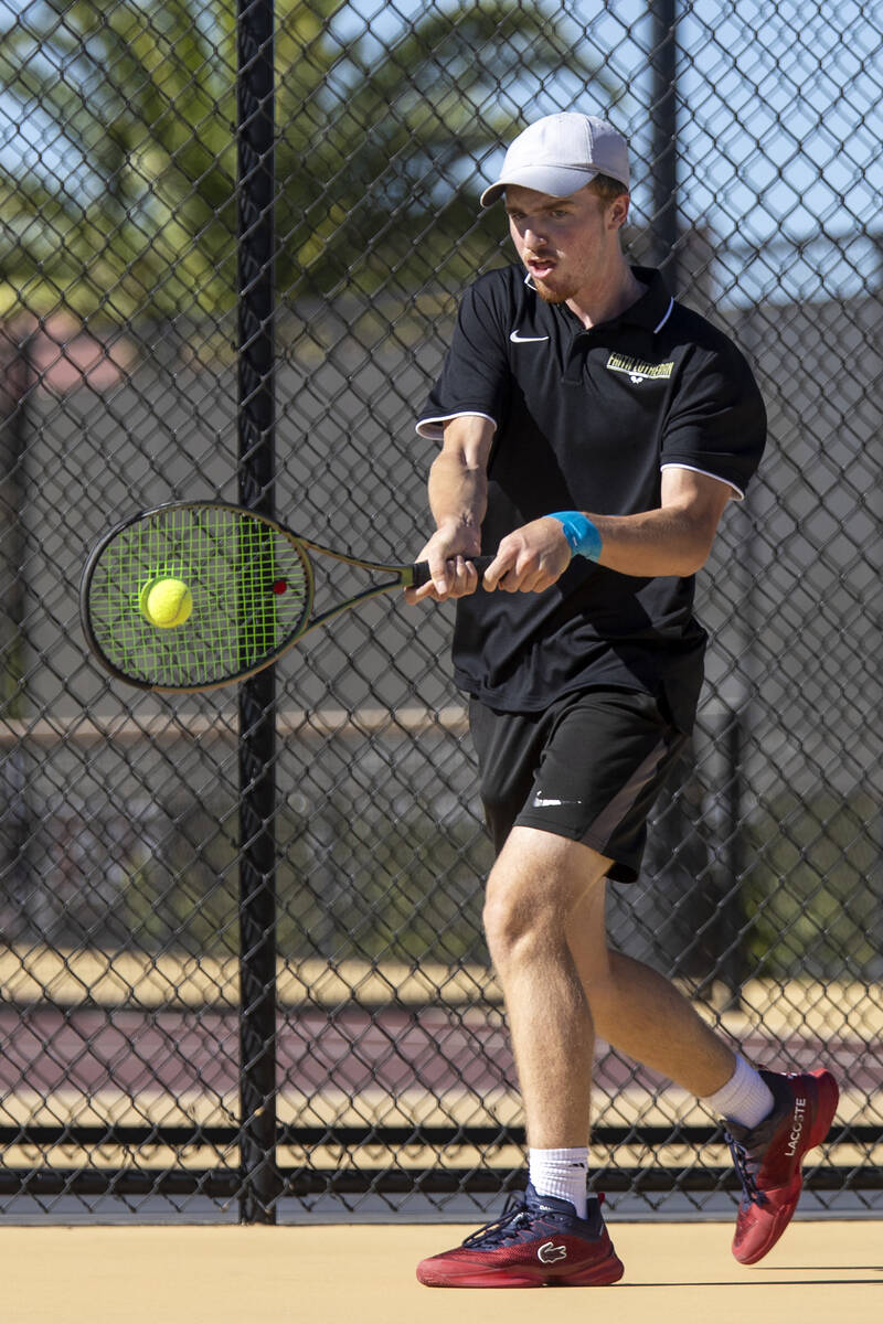 Faith Lutheran senior Nolan Dubay competes during the tennis matches against The Meadows at Fai ...