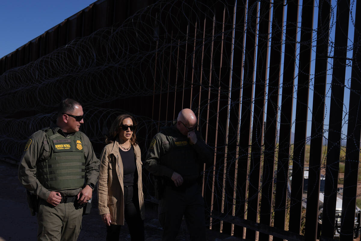 Democratic presidential nominee Vice President Kamala Harris talks with John Modlin, the chief ...