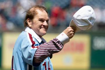 Pete Rose acknowledges fans during a ceremony honoring the 1980 Phillies World Series team at C ...