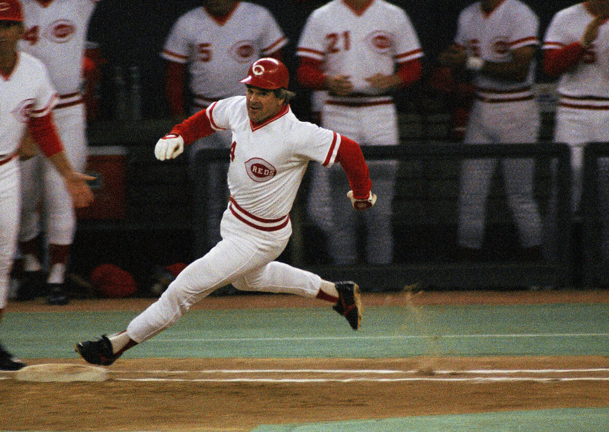 FILE - In this Sept. 11, 1985, file photo, Cincinnati Reds' Pete Rose rounds first base after h ...