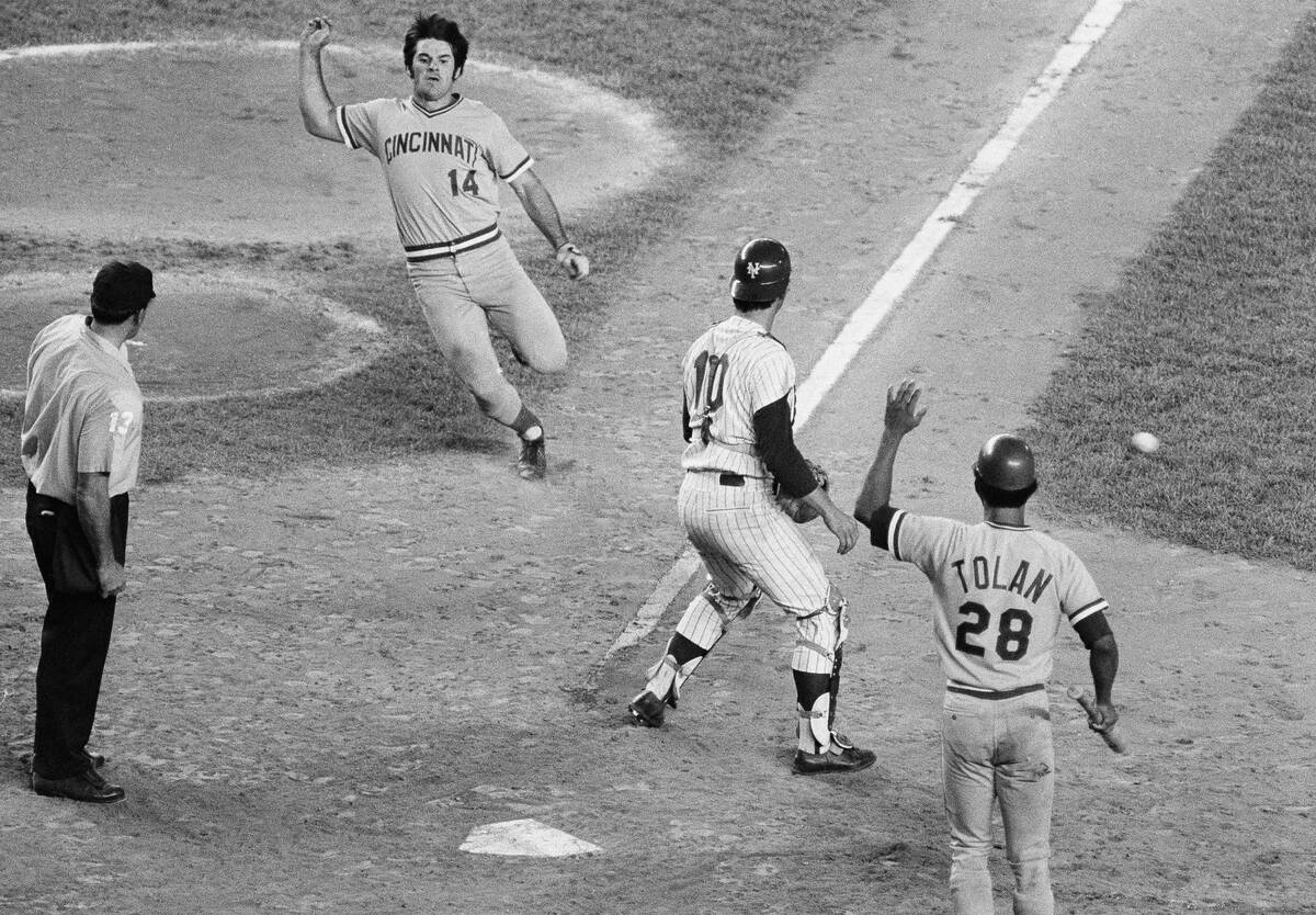 Cincinnati Reds' Pete Rose comes in from second for a score against the New York Mets in the ei ...