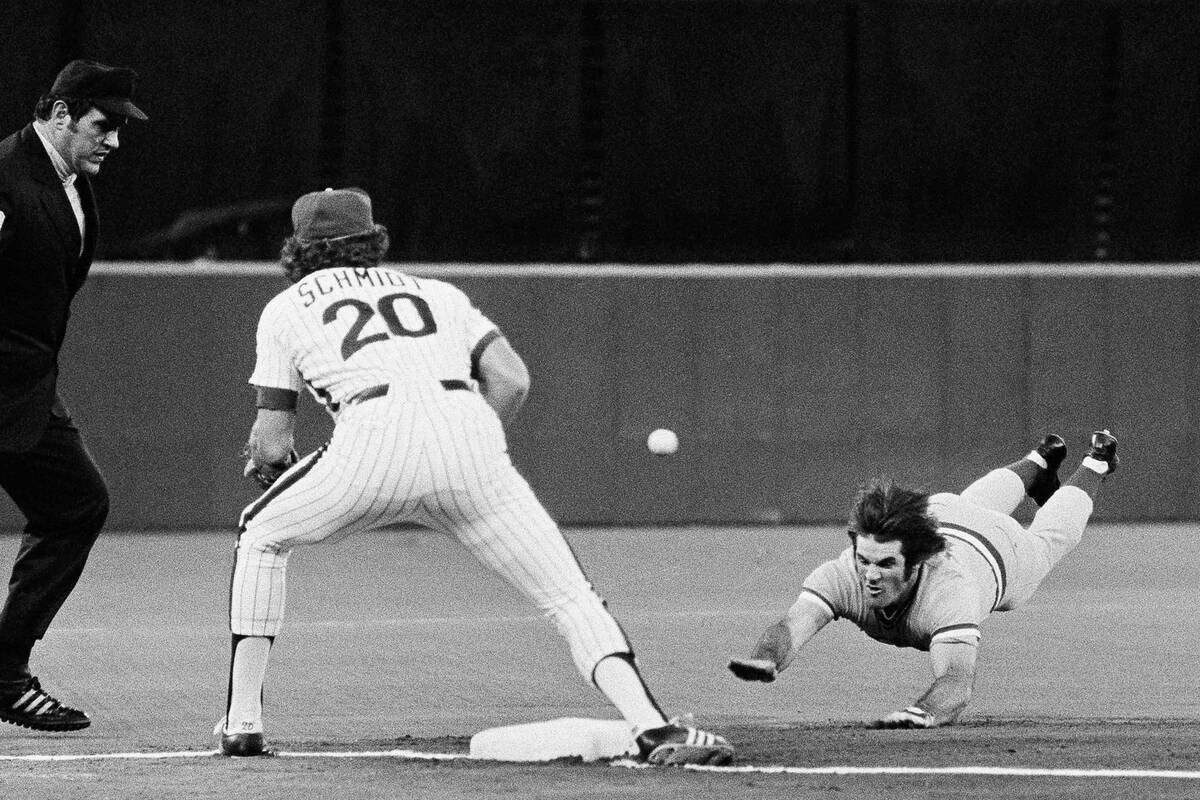 Cincinnati Reds Pete Rose slides head first into third base for a triple as Philadelphia Philli ...