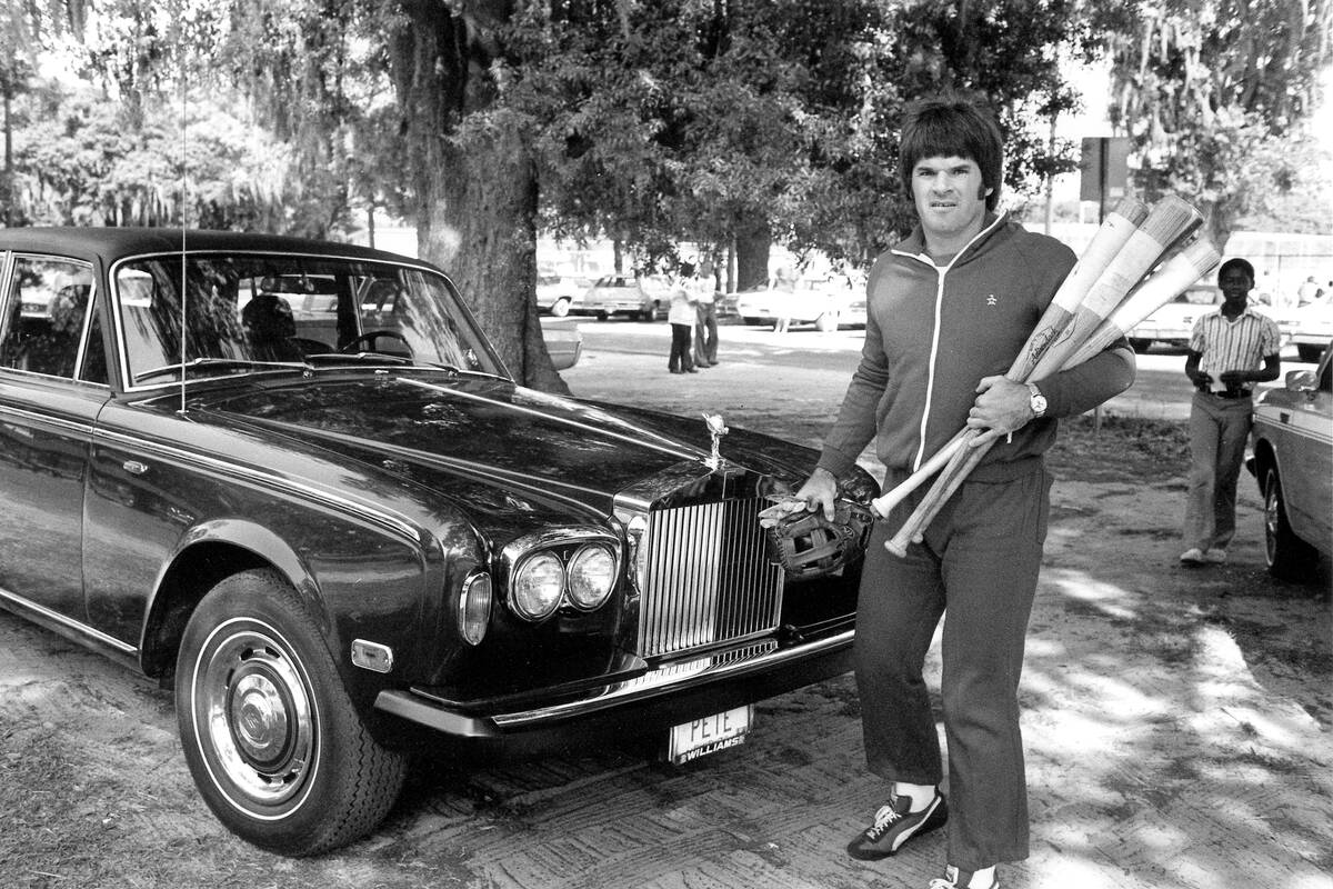 Cincinnati Reds star Pete Rose arrives in his Rolls-Royce to workout at the West Tampa baseball ...