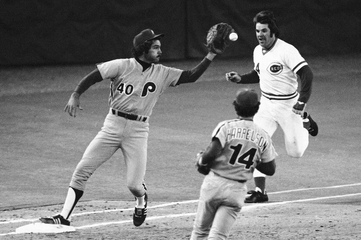 Cincinnati Reds batter Pete Rose, right, comes up two steps short as he tries for a single in t ...