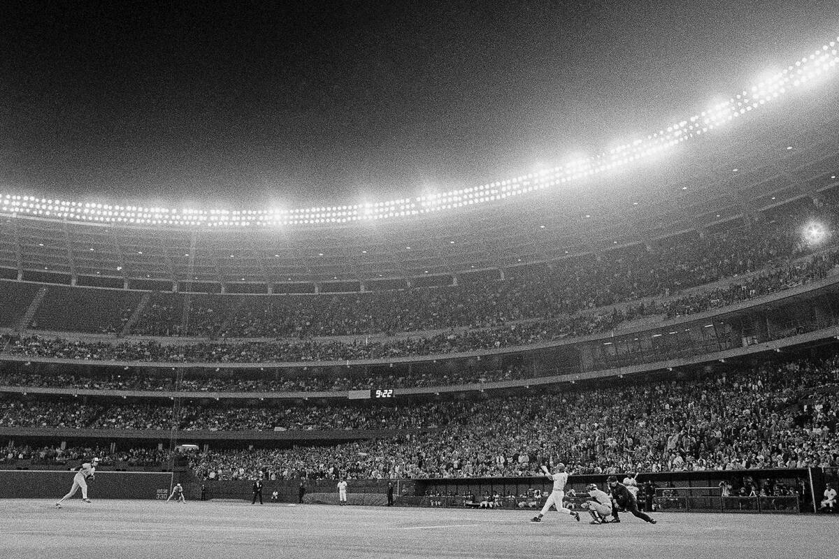 Cincinnati Reds batter Pete Rose drives a single against the Montreal Expos to reach the 3,000 ...