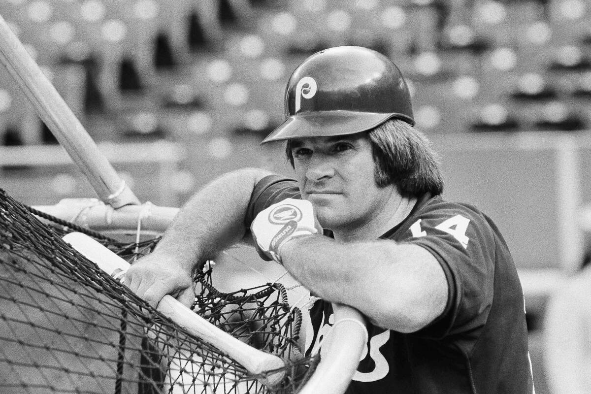 Pete Rose rests his head on his arms as he waits his turn for batting practice prior to the Ast ...