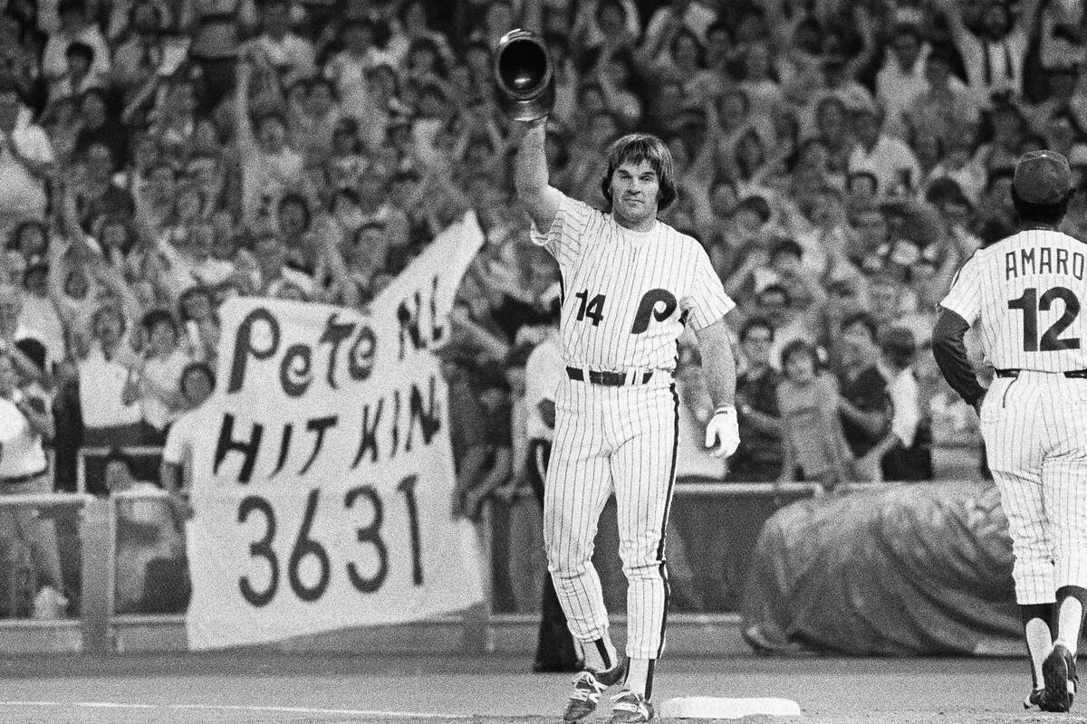 Phillies Pete Rose waves to huge crowd while standing on first base on Monday night, August 10, ...