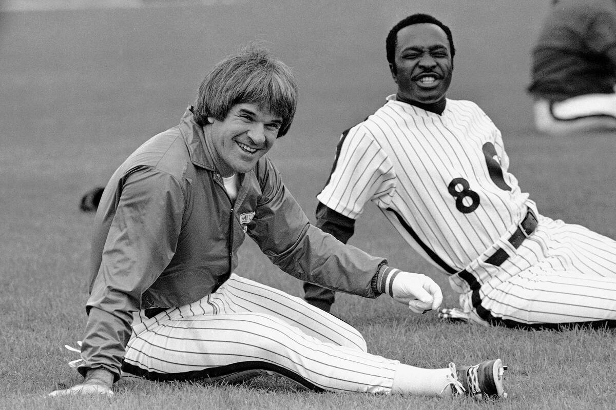 Phillies first baseman Pete Rose and second baseman Joe Morgan laugh as they are kidded by team ...