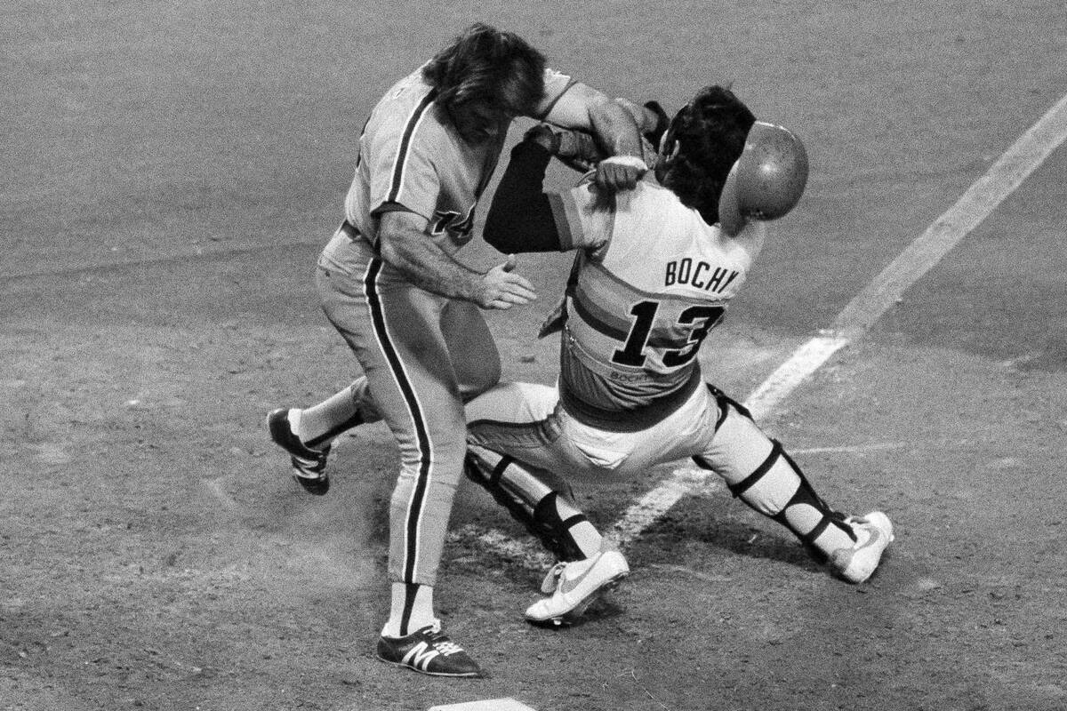 Philadelphia Phillies first baseman Pete Rose, colliding with Houston Astros catcher Bruce Boch ...