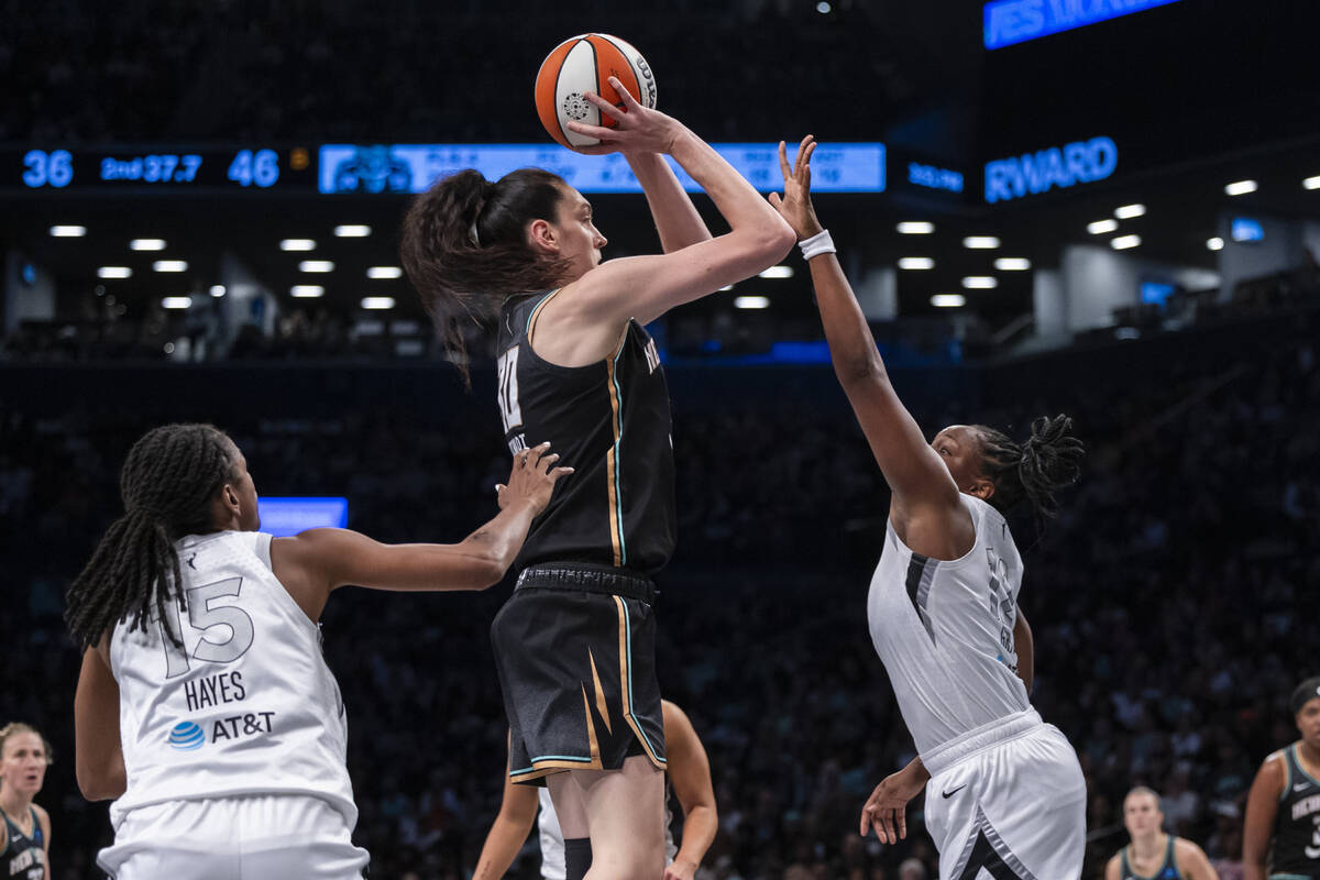 New York Liberty forward Breanna Stewart (30) shoots over Las Vegas Aces guard Tiffany Hayes (1 ...